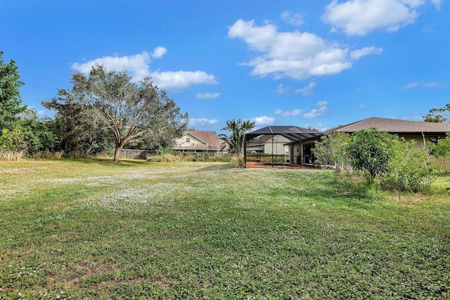 view of yard featuring a lanai