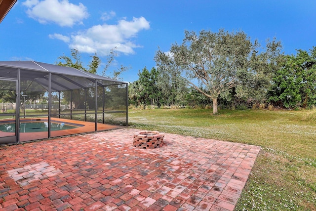 view of patio featuring an outdoor pool, a fire pit, and glass enclosure