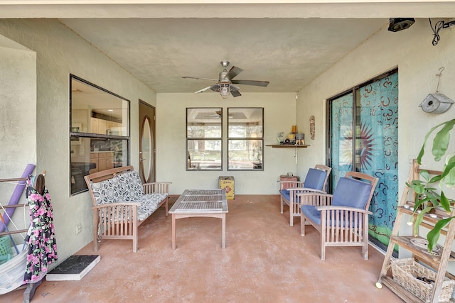 exterior space featuring a ceiling fan