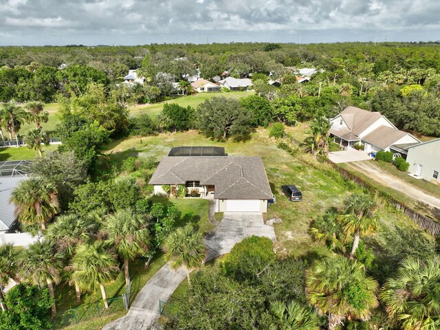 8865 SE May Ter, Hobe Sound, FL 33455 - aerial overview of property's location with a heavily wooded area and nearby suburban area