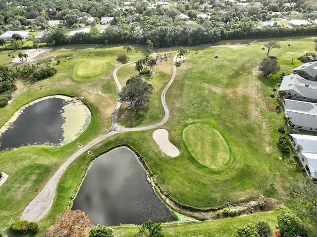 bird's eye view with golf course view, a residential view, and a water view
