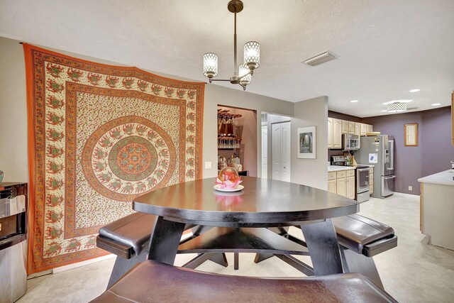 8865 SE May Ter, Hobe Sound, FL 33455 - dining space featuring baseboards, a chandelier, and recessed lighting