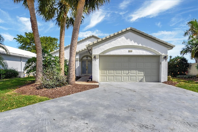 ranch-style home featuring a garage