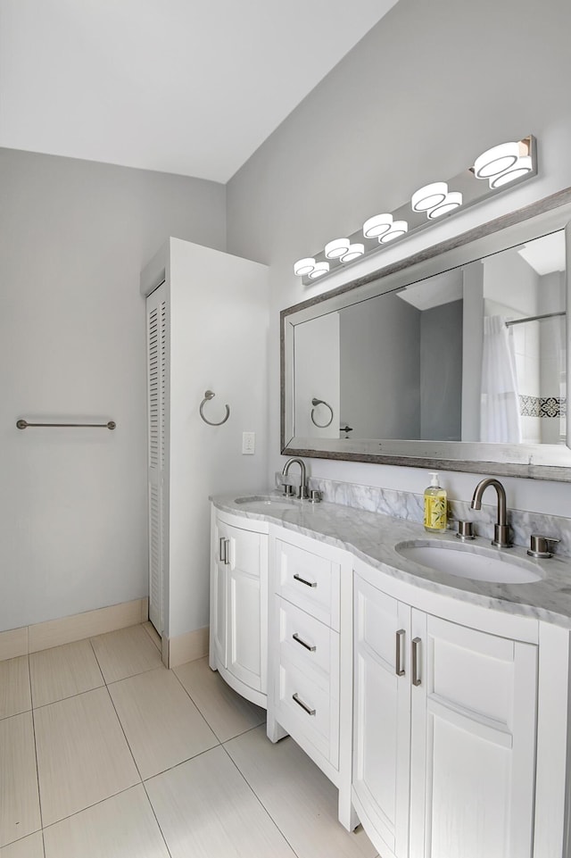 bathroom featuring vanity and tile patterned flooring