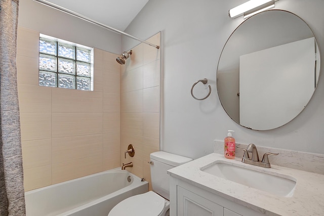 full bathroom featuring vanity, toilet, and tiled shower / bath combo