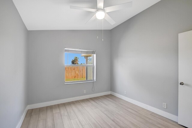 unfurnished bedroom featuring high vaulted ceiling, a closet, light hardwood / wood-style flooring, and ceiling fan