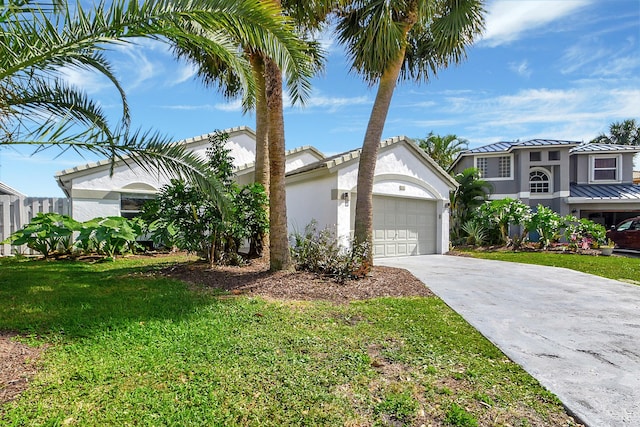 view of front of house featuring a garage and a front lawn