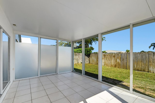 unfurnished sunroom with a wealth of natural light