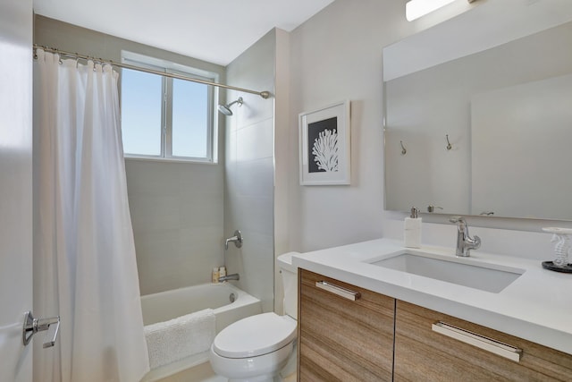 full bathroom with shower / bath combo with shower curtain, vanity, and toilet