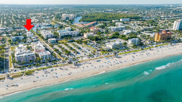 bird's eye view with a view of the beach and a water view