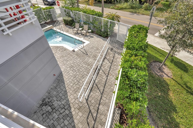 view of swimming pool with a patio