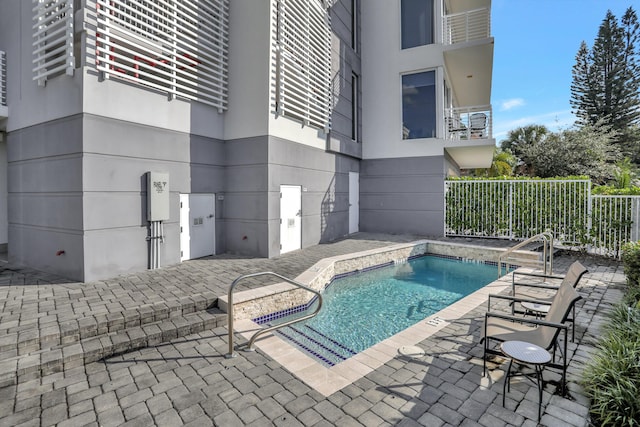 view of pool featuring a patio area