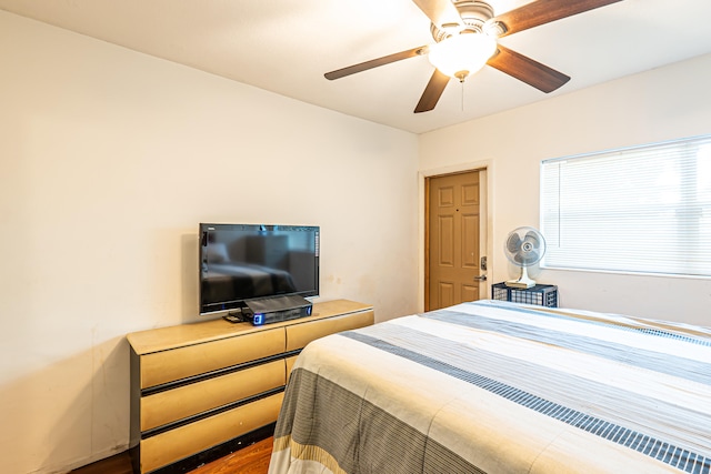 bedroom featuring wood-type flooring and ceiling fan