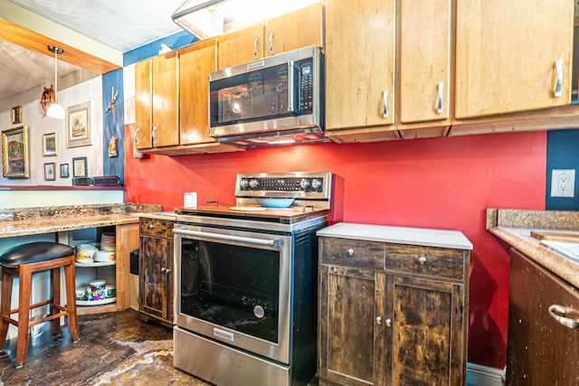 kitchen featuring decorative light fixtures and stainless steel appliances