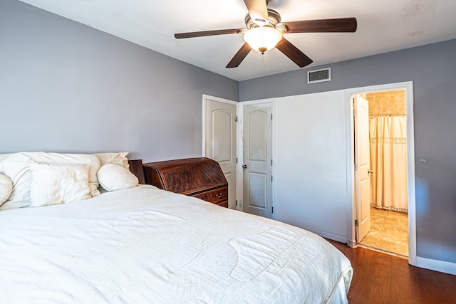 bedroom with ceiling fan and dark wood-type flooring