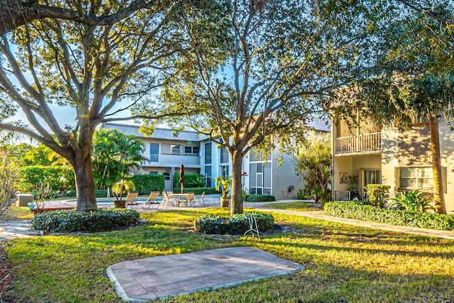 view of community featuring a yard