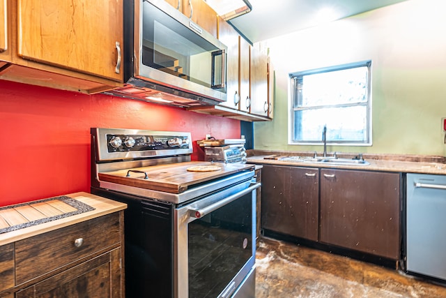 kitchen with sink and appliances with stainless steel finishes