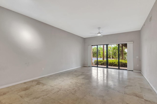 unfurnished room with visible vents, baseboards, and ceiling fan