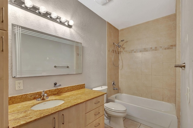 bathroom with toilet, shower / bathtub combination, tile patterned flooring, vanity, and a textured wall