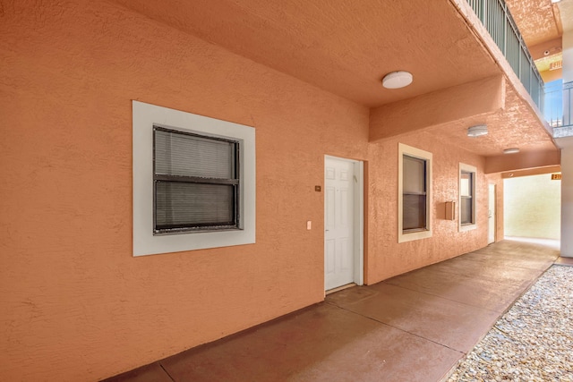 doorway to property featuring a patio area