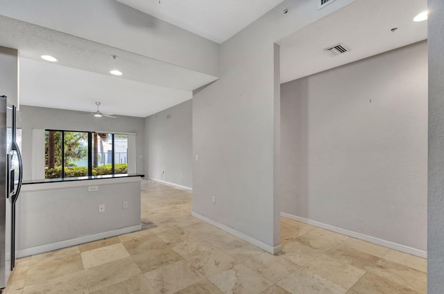 spare room featuring visible vents, recessed lighting, baseboards, and ceiling fan