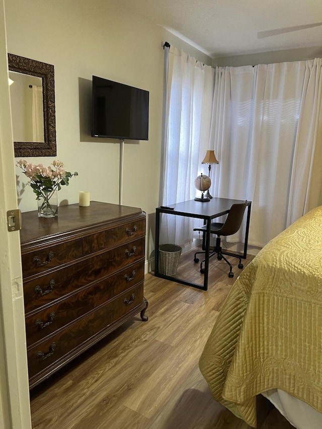 bedroom with light hardwood / wood-style floors