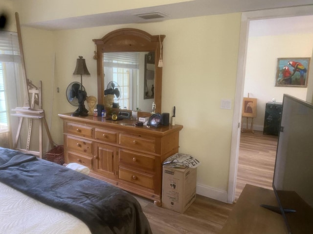 bedroom with light hardwood / wood-style floors