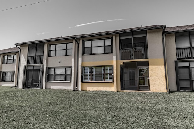 back of house featuring stucco siding