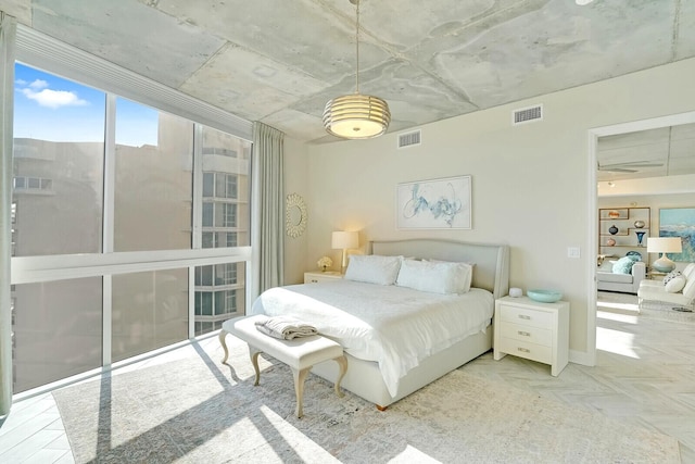 bedroom with a wall of windows