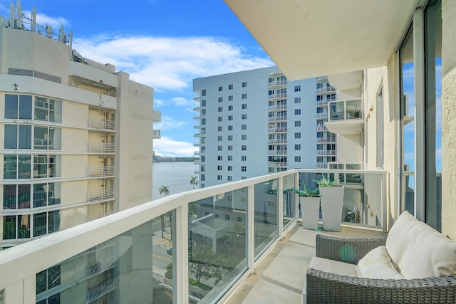 balcony featuring a water view