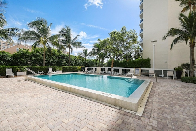 view of swimming pool featuring a patio