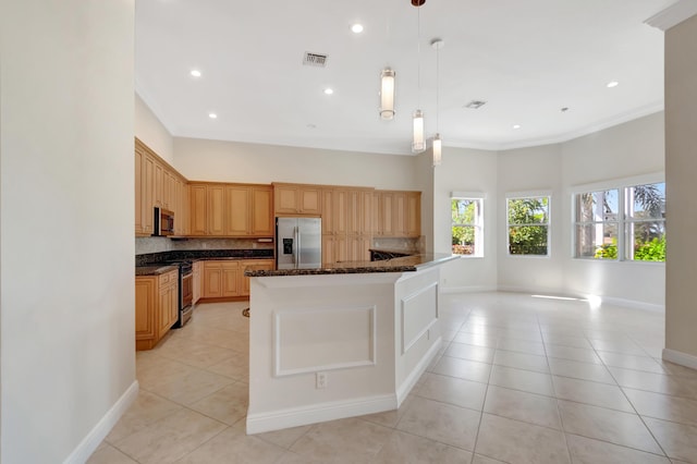 kitchen featuring tasteful backsplash, stainless steel appliances, decorative light fixtures, a kitchen island, and light tile patterned flooring