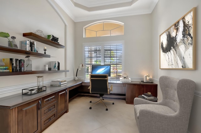 office featuring light tile patterned floors, a raised ceiling, and ornamental molding