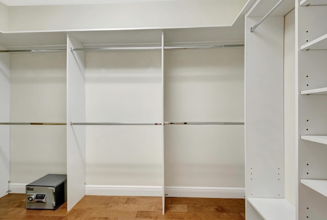 walk in closet featuring hardwood / wood-style flooring