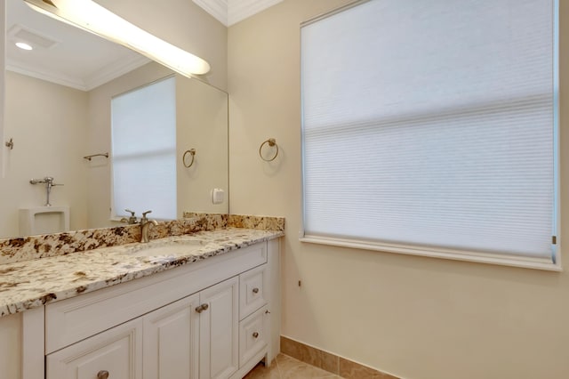 bathroom featuring crown molding, tile patterned flooring, and vanity