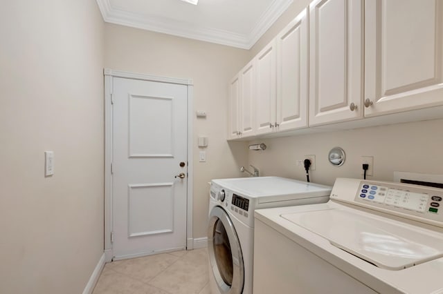 washroom with separate washer and dryer, light tile patterned floors, cabinets, and ornamental molding