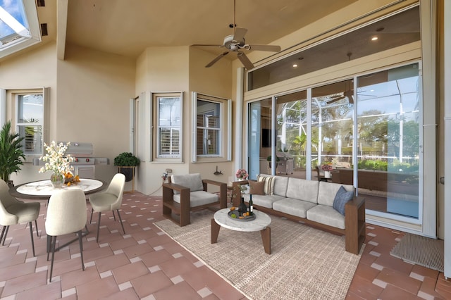 view of patio featuring grilling area, ceiling fan, and an outdoor hangout area