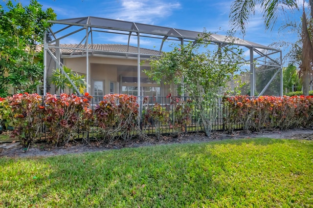 view of yard featuring a lanai