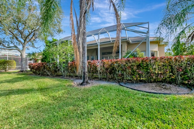 view of yard with a lanai