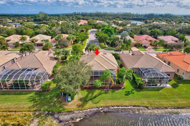 birds eye view of property with a water view