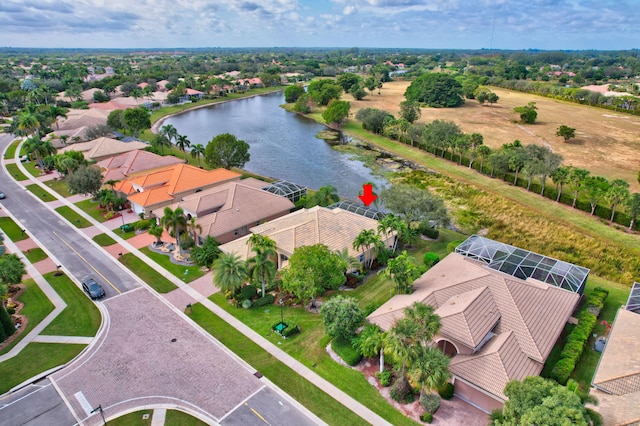 birds eye view of property with a water view