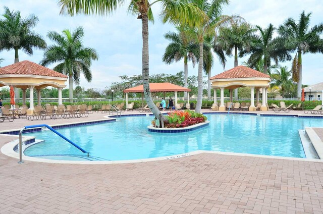 view of pool featuring a gazebo and a patio