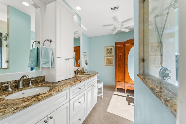 bathroom featuring vanity, tile patterned flooring, ceiling fan, toilet, and an enclosed shower