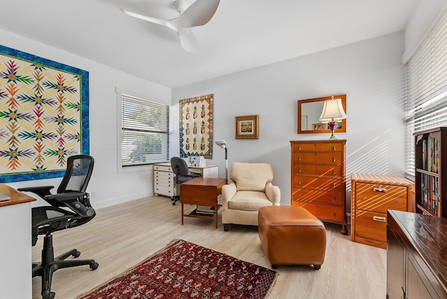 office space with ceiling fan and light wood-type flooring