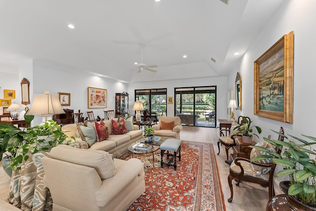 living room with ceiling fan and light hardwood / wood-style floors