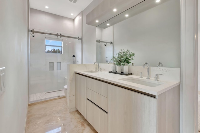 bathroom with walk in shower, vanity, and toilet