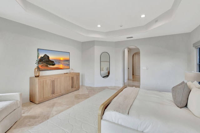 bedroom with a tray ceiling