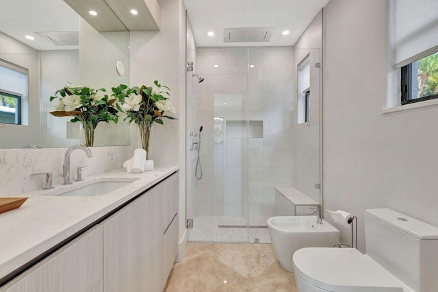 bathroom with vanity, toilet, an enclosed shower, and a bidet