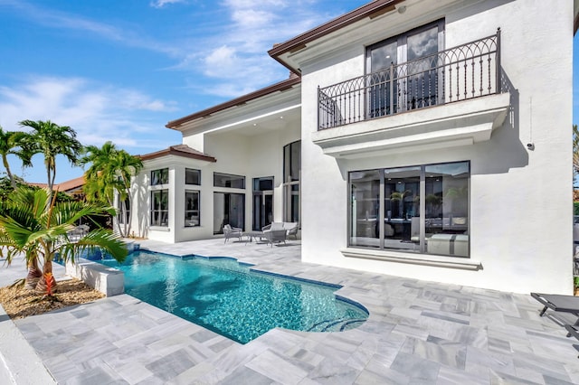 view of swimming pool with a patio area