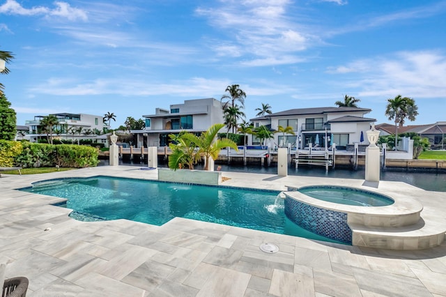 view of pool with an in ground hot tub, pool water feature, and a patio